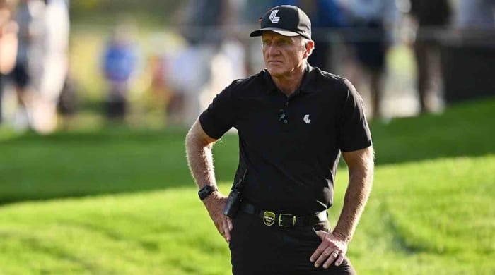 Greg Norman watches the action on the 18th green during the final round of the 2023 LIV Golf Chicago golf tournament at Rich Harvest Farms.